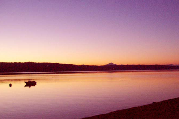 In summer, the water in Port Susan Bay in front of The Beach House at Tyee can be smooth as glass.