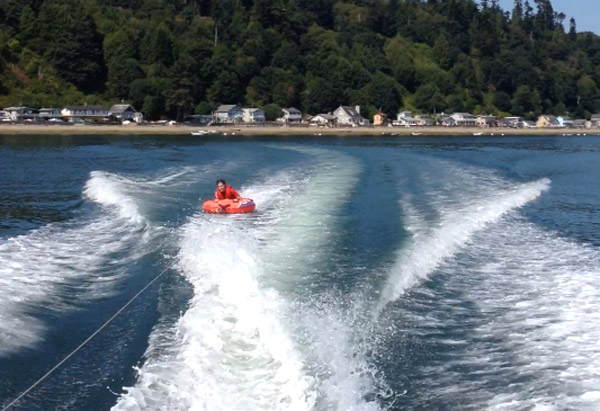 Moor your boat at The Beach House at Tyee private mooring buoy, and then take the kids innertubing, wakeboarding, waterskiing or just cruising